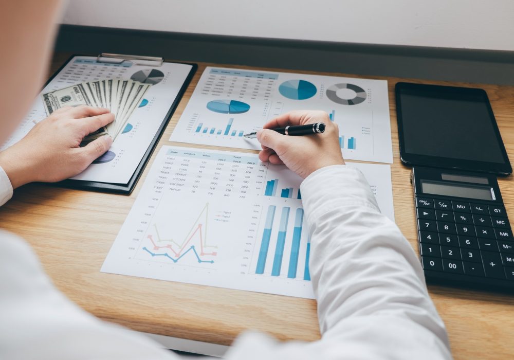businessman-working-on-a-graph-document-financial-report-and-analysis-calculation-investment-cost.jpg businessman-working-on-a-graph-document-financial-report-and-analysis-calculation-investment-cost.jpg